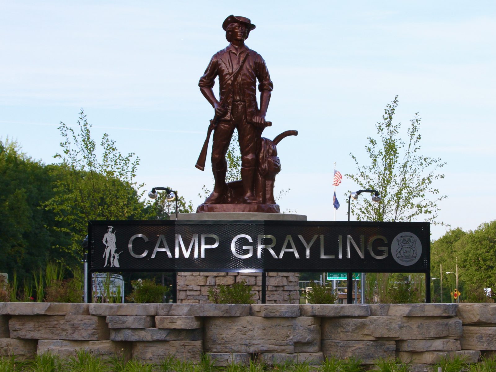 A stoic statue at Camp Grayling, standing as a sentinel and a symbol of honor.